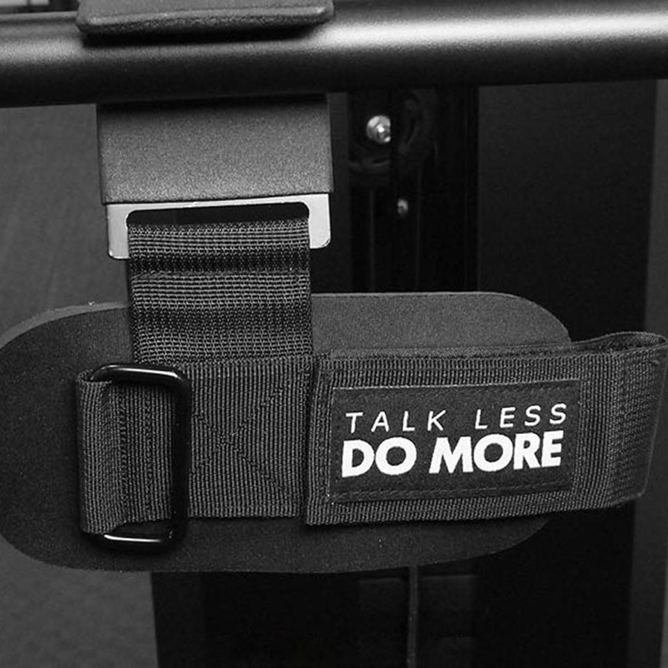 Close-up of hook grip strap with “Talk Less Do More” printed on it
