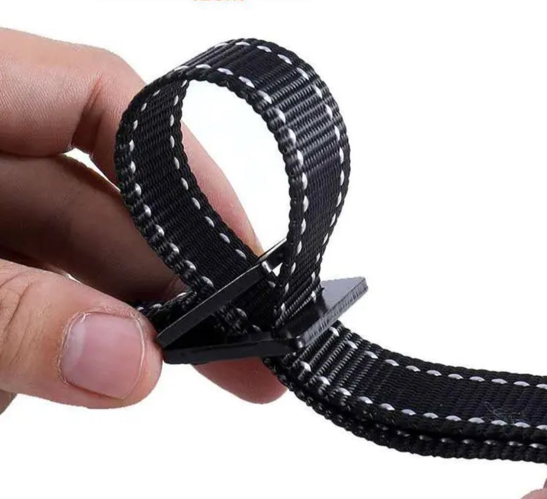 Adjustable nylon strap system for gymnastic rings showing belt-style tightening mechanism